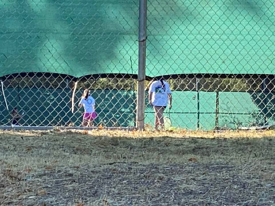 Sitting in the car watching pink PJ at tennis practice. So proud she made the team. Best dad moment!